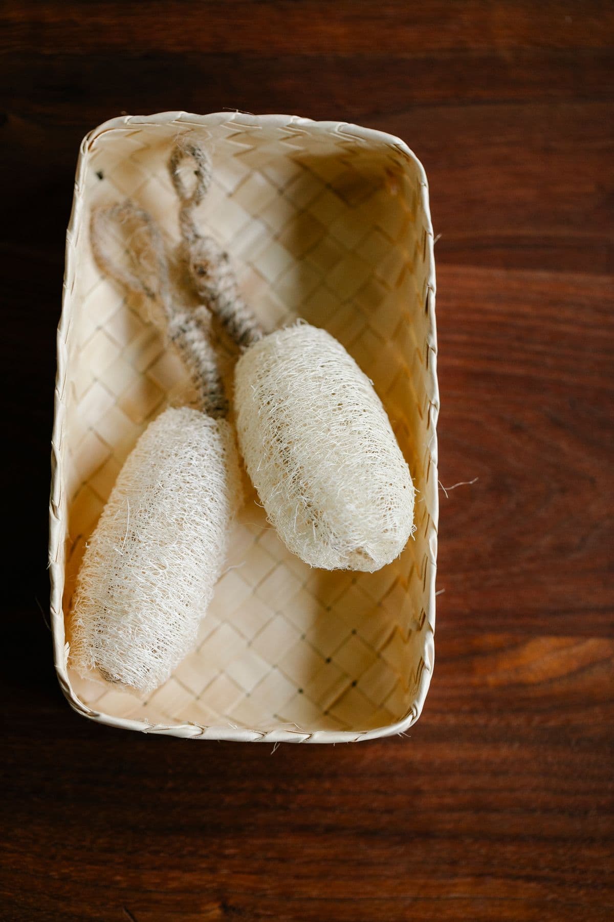 Natural loofah sponges in a basket for bath and personal care sourcing