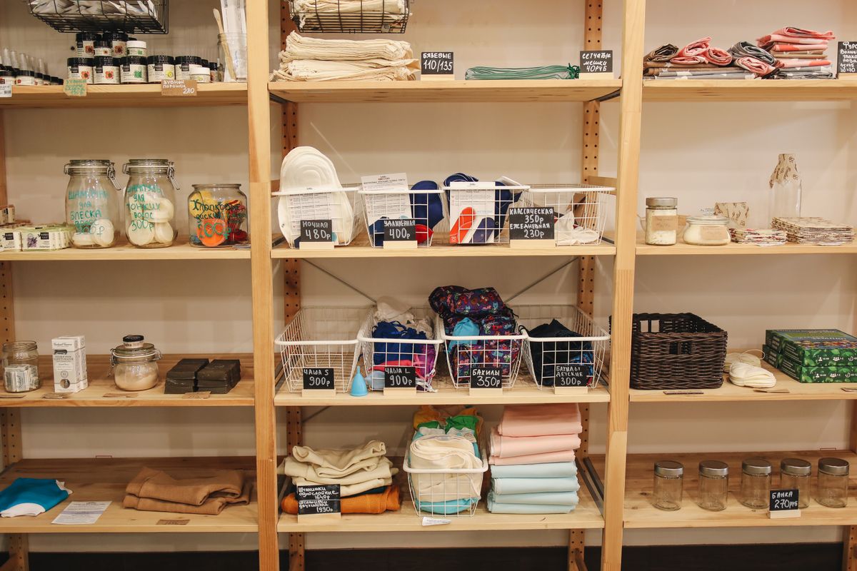Eco store wooden shelves displaying natural loofah and zero-waste products